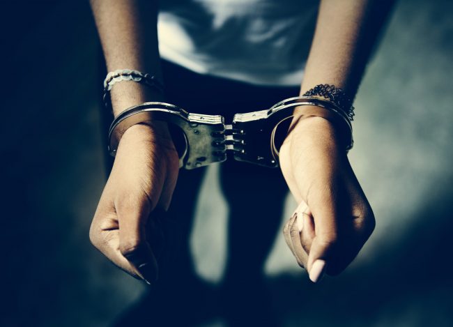 Prisoner with handcuffs on hands
