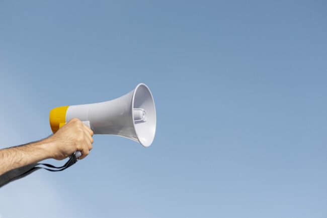 protester-holding-megaphone-demonstration