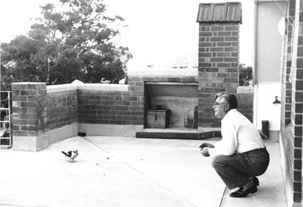 A kookaburra being fed by Vladimir Petrov on the verandah of the ‘safe house’ where he and his wife Evdokia Petrov were held following their defection to Australia.  Photograph circa 1954 presented as evidence to the Royal Commission on Espionage, National Archives of Australia, Series/Control symbol A6285, 4. A kookaburra being fed by Vladimir Petrov on the verandah of the ‘safe house’ where he and his wife Evdokia Petrov were held following their defection to Australia. Photograph circa 1954 presented as evidence to the Royal Commission on Espionage, National Archives of Australia, Series/Control symbol A6285, 4.