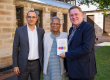 Adam Geha, Muhammad Yunus, and Michael Easson, with the book A World of Three Zeros.