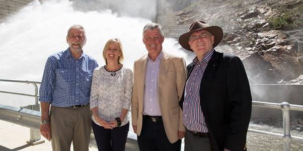 The water gushes at the new Cotter Dam opening on 12 October 2013. In the frame are John Dymke, Chief Engineer, ACTEW, Katy Gallagher, Chief Minister, March Sullivan, CEO of ACTEW, and ACTEW Chair Michael Easson.