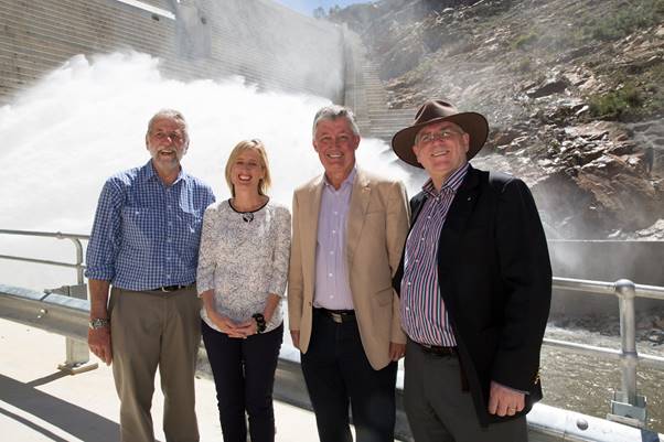 The water gushes at the new Cotter Dam opening on 12 October 2013. In the frame are John Dymke, Chief Engineer, ACTEW, Katy Gallagher, Chief Minister, March Sullivan, CEO of ACTEW, and ACTEW Chair Michael Easson.