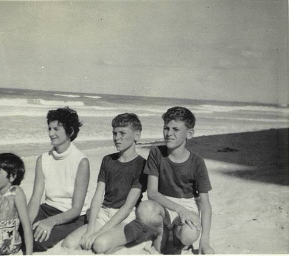 A photo of Maree (obscured), mum, Shane, and I.