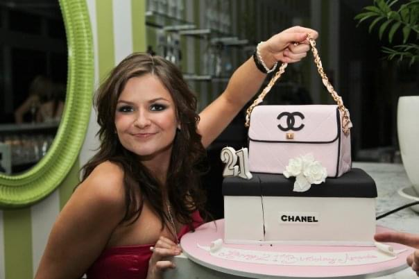 Amanda with the “Chanel cake” that Mary had ordered, before she took ill, for the birthday celebrations.