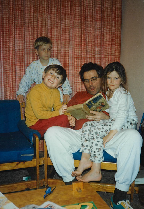 Dad reading a story, with cousins Jackson & Bennett, on holidays at Thredbo.