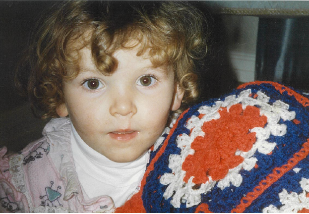 Amanda with her “googol”, as she called her red, white and blue blanket.