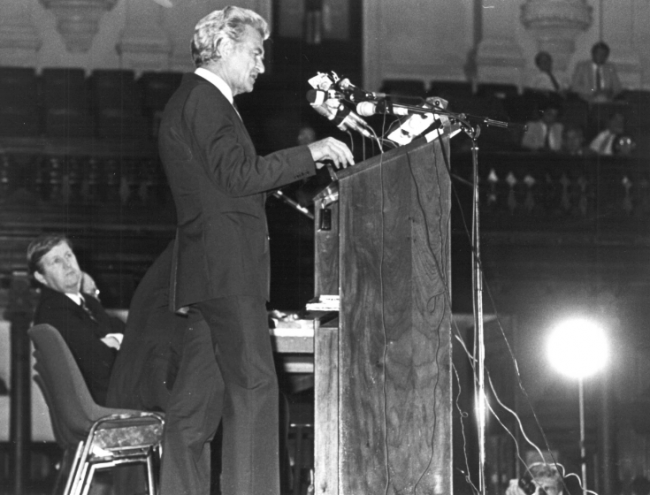 The “Four Unions” who left the Victorian ALP during the ALP split of 1955 were supporters of Bob Hawke and wanted to turn the tide from Leftwing control of the Victorian ALP Branch.   This photo shows Prime Minister Bob Hawke at the Sydney Town Hall addressing delegates at the 1984 Labor Council Annual General meeting.  Labor Council secretary Barrie Unsworth leans back on the stage.  Photo: from Michael Easson papers, Noel Butlin Archives, Menzies Library, Australian National University. The “Four Unions” who left the Victorian ALP during the ALP split of 1955 were supporters of Bob Hawke and wanted to turn the tide from Leftwing control of the Victorian ALP Branch. This photo shows Prime Minister Bob Hawke at the Sydney Town Hall addressing delegates at the 1984 Labor Council Annual General meeting. Labor Council secretary Barrie Unsworth leans back on the stage. Photo: from Michael Easson papers, Noel Butlin Archives, Menzies Library, Australian National University.